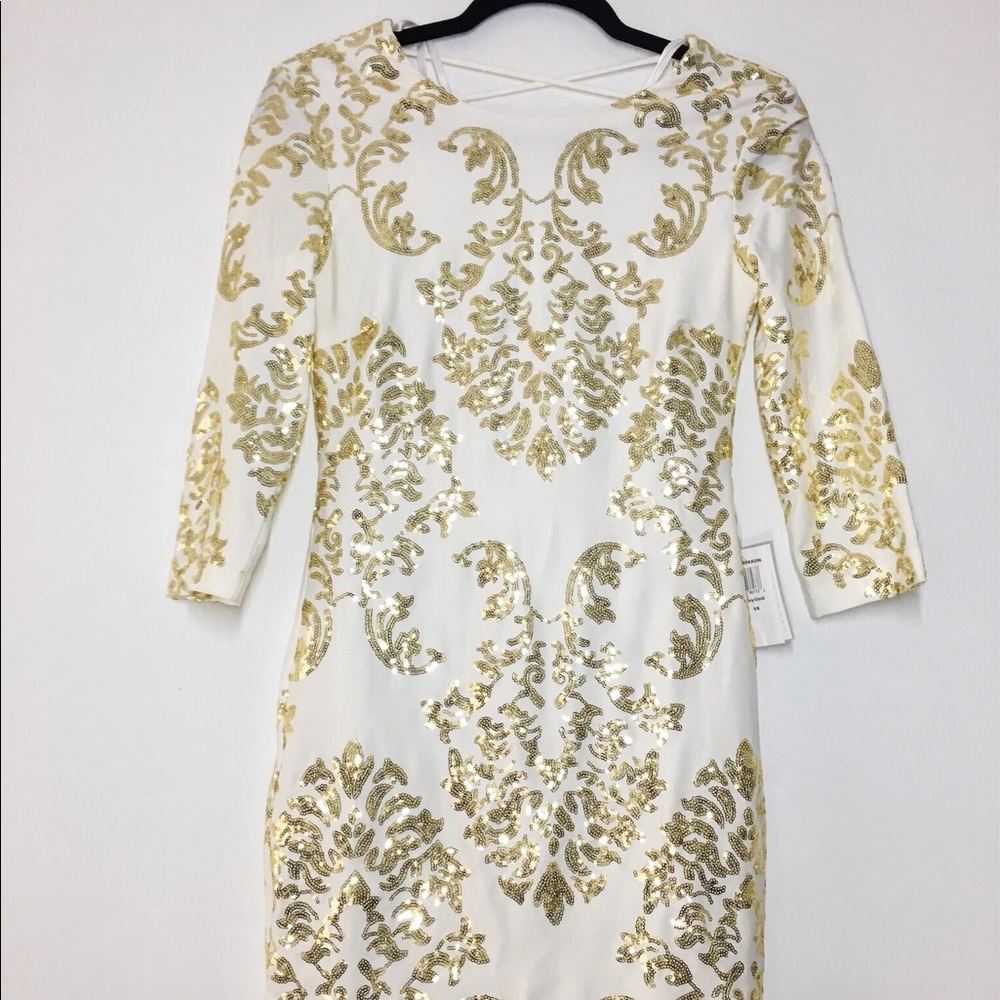 white dress with gold design